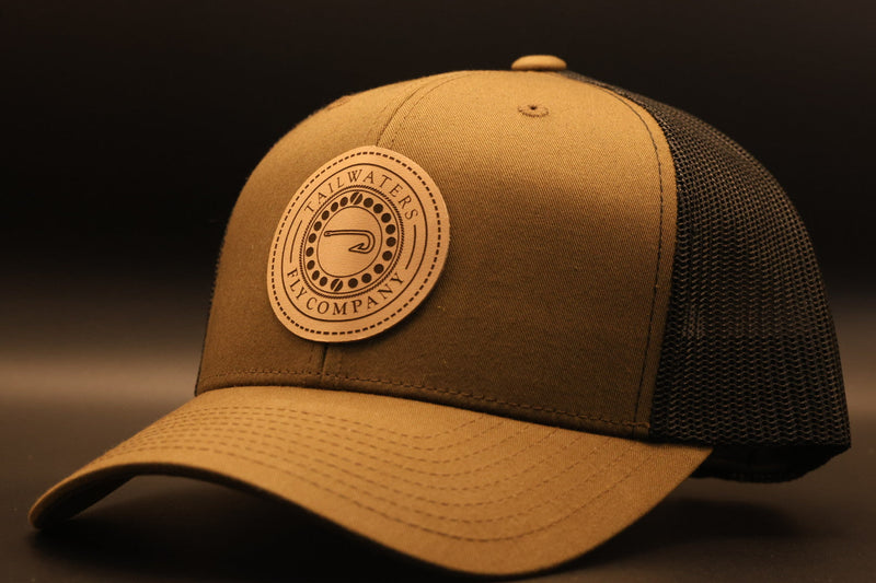 Brown and black Tailwaters Fly Company Trucker Cap